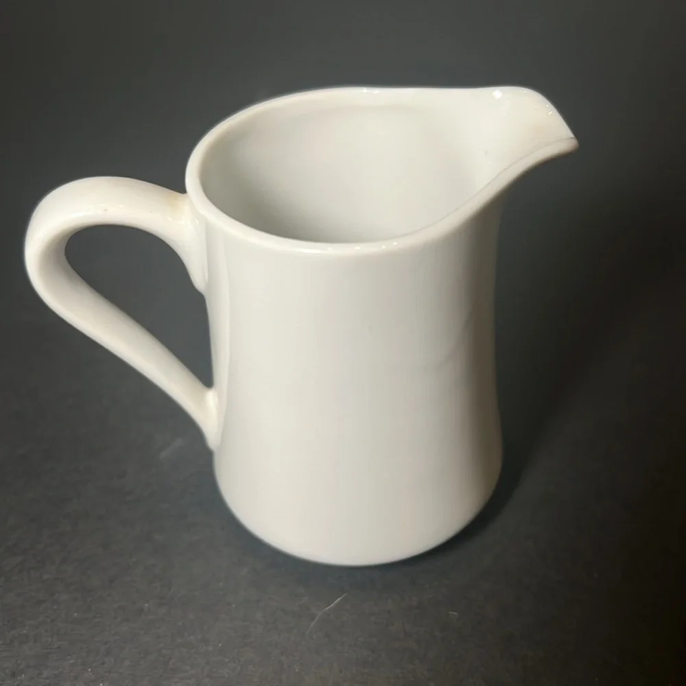 Vintage white porcelain cream‎ and sugar with floral design